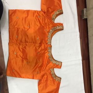 Orange cold shoulder blouse